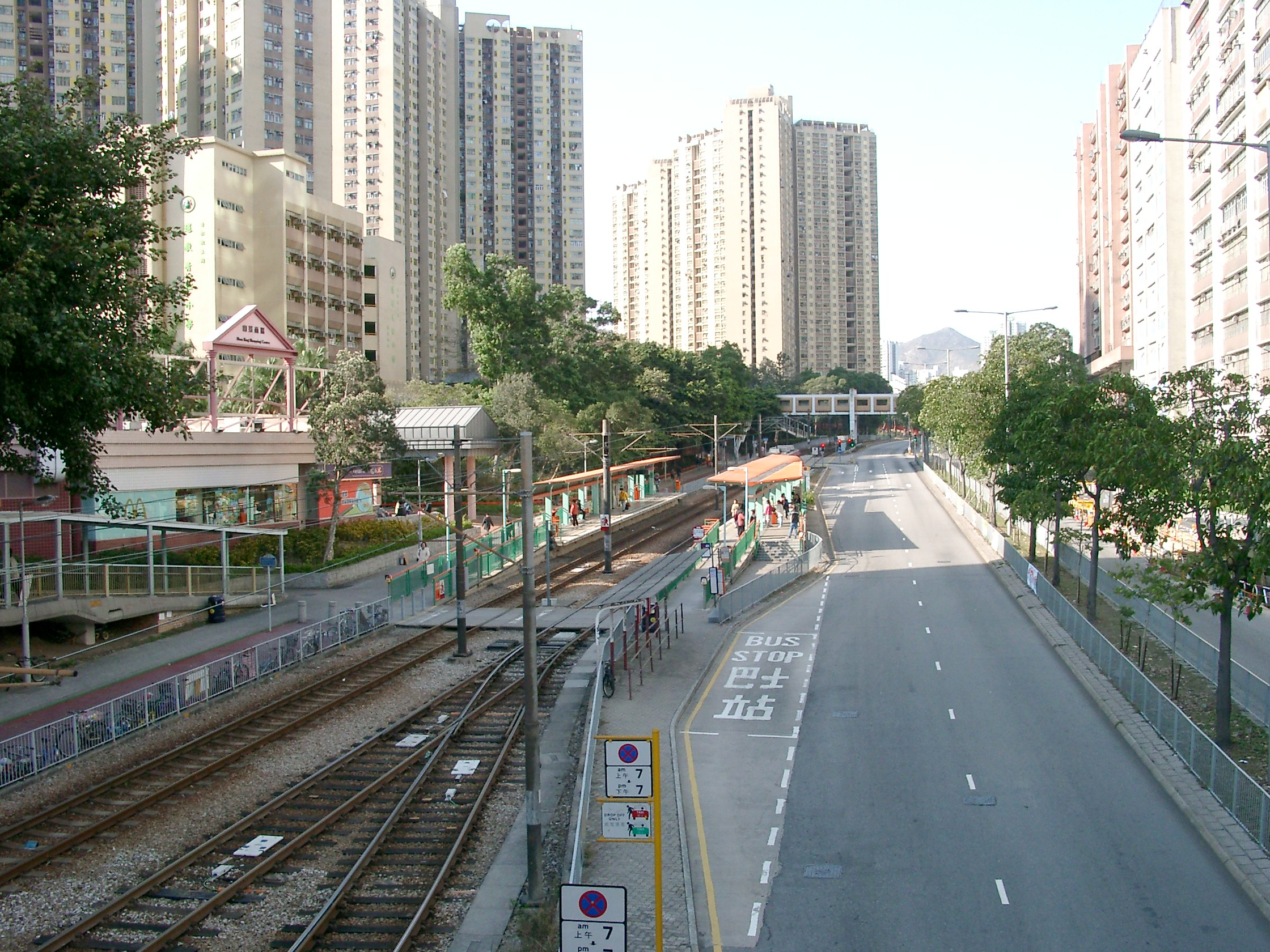 LRT in Hong Kong, with fences on both sides of the rail, except the crossings